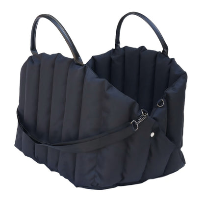 Sleek black padded pet carrier with sturdy handles, ideal for safe and comfortable car travel with small dogs or cats