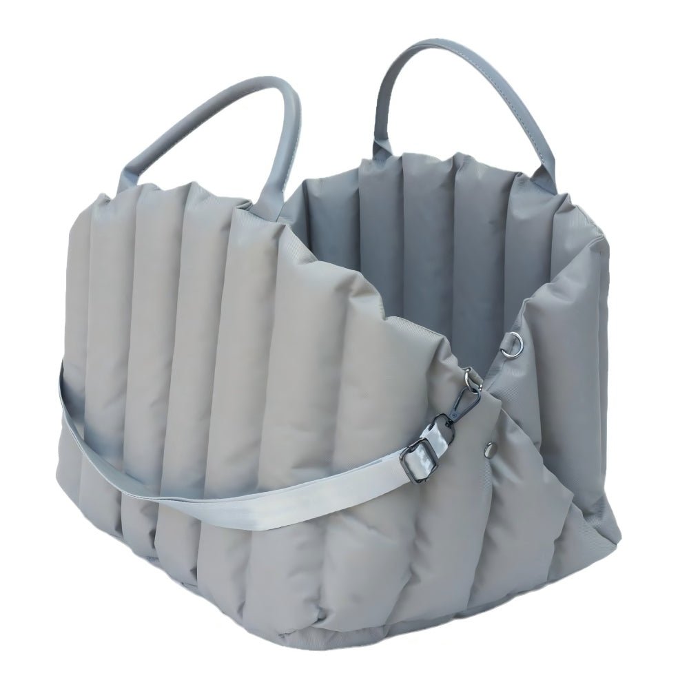 Blue padded pet carrier with detachable shoulder strap, designed for easy transportation of small dogs and cats during car rides and daily outings