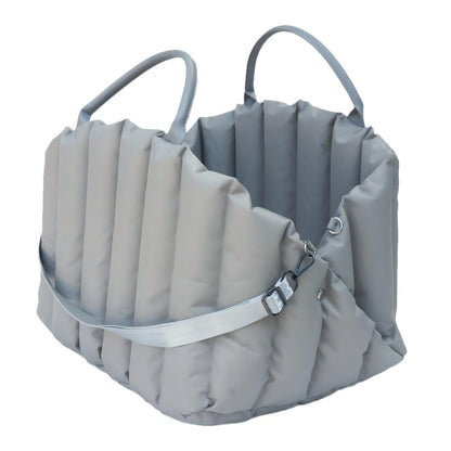 Blue padded pet carrier with detachable shoulder strap, designed for easy transportation of small dogs and cats during car rides and daily outings