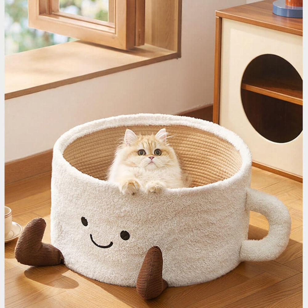 Adorable teacup-shaped plush pet bed with a fluffy cat resting inside, blending playful design with cozy comfort for cats and small dogs.