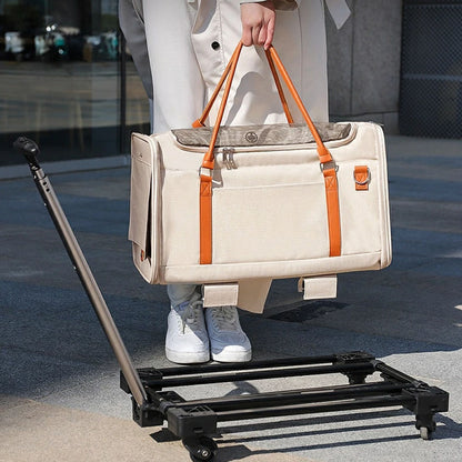 Detachable pet carrier with wheels, shown separated from its rolling base, convertible between a handbag and rolling carrier for versatile travel with small dogs and cats.
