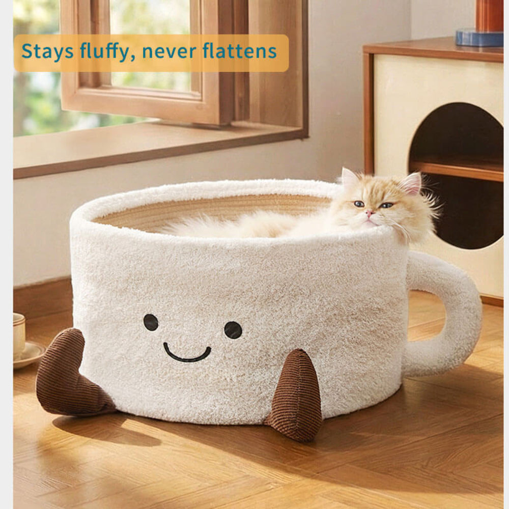 Teacup pet bed retaining its fluffy shape after use, with a cat peeking out to highlight long-lasting support and non-flattening, durable construction.
