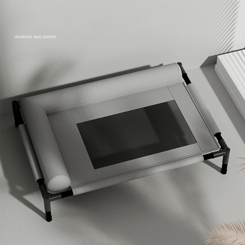 Elevated pet cot bed with semi-enclosed bolster pillow, breathable mesh center, and sturdy black metal frame, shown in a minimalist indoor setting for dogs and cats, all-season use.