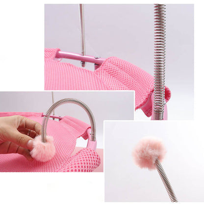 Detailed view of flexible spring pom-pom toys attached to cat hammock, designed to entertain and engage cats during rest and play.
