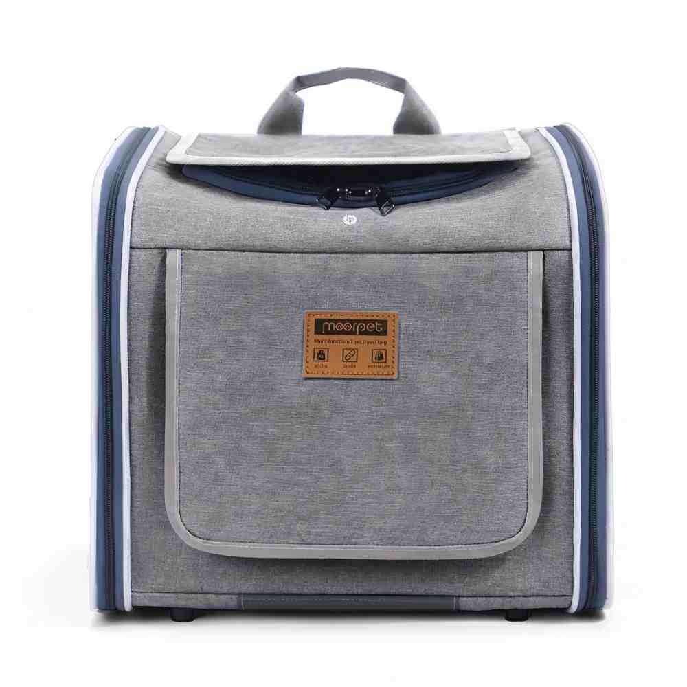 Front view of a grey multi-functional pet carrier with a weather-resistant fabric exterior, a front storage pocket, and reinforced zippers, designed to withstand outdoor wear, rain, and sun while adapting to summer ventilation and winter warmth needs.