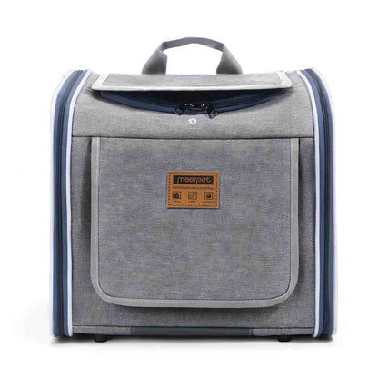 Front view of a grey multi-functional pet carrier with a weather-resistant fabric exterior, a front storage pocket, and reinforced zippers, designed to withstand outdoor wear, rain, and sun while adapting to summer ventilation and winter warmth needs.