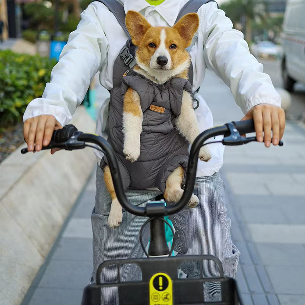 Gray pet front carrier backpack holding a Corgi during cycling: secure, anti-shake design keeps pets safe & comfortable while commuting or biking outdoors.