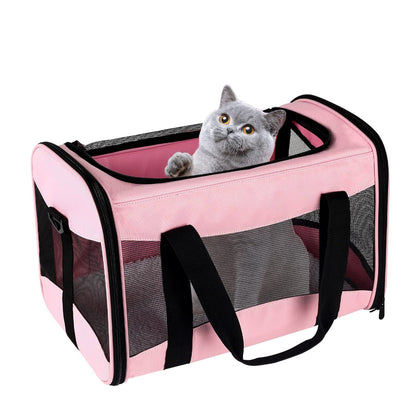 Pink pet carrier with a grey cat inside, featuring mesh ventilation and a cozy interior – a stylish solution to ease your pet’s travel stress, perfect for cats/small dogs during journeys or vet appointments.