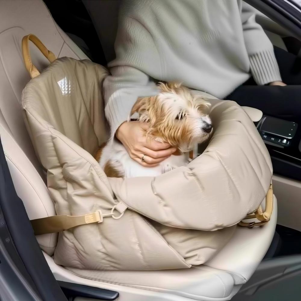 Small dog resting in a soft padded pet carrier secured in a car seat, ensuring safe and comfortable travel for your furry companion
