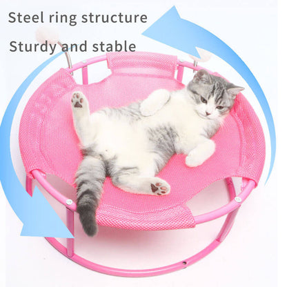 Pink cat hammock with steel ring structure, a tabby cat lying comfortably on it, highlighting the sturdy, stable design that supports cats of all sizes.

