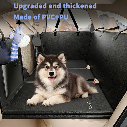 Happy Alaskan Malamute sitting comfortably on upgraded thickened dog back seat extender made of durable PVC+PU material, providing sturdy support and waterproof protection for car seats.