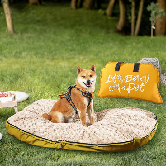 Shiba Inu resting on a plush, waterproof dog bed mat on a grassy lawn, with a yellow "Life is Better with a Pet" carry bag beside it, ideal for camping, hiking, and outdoor adventures.